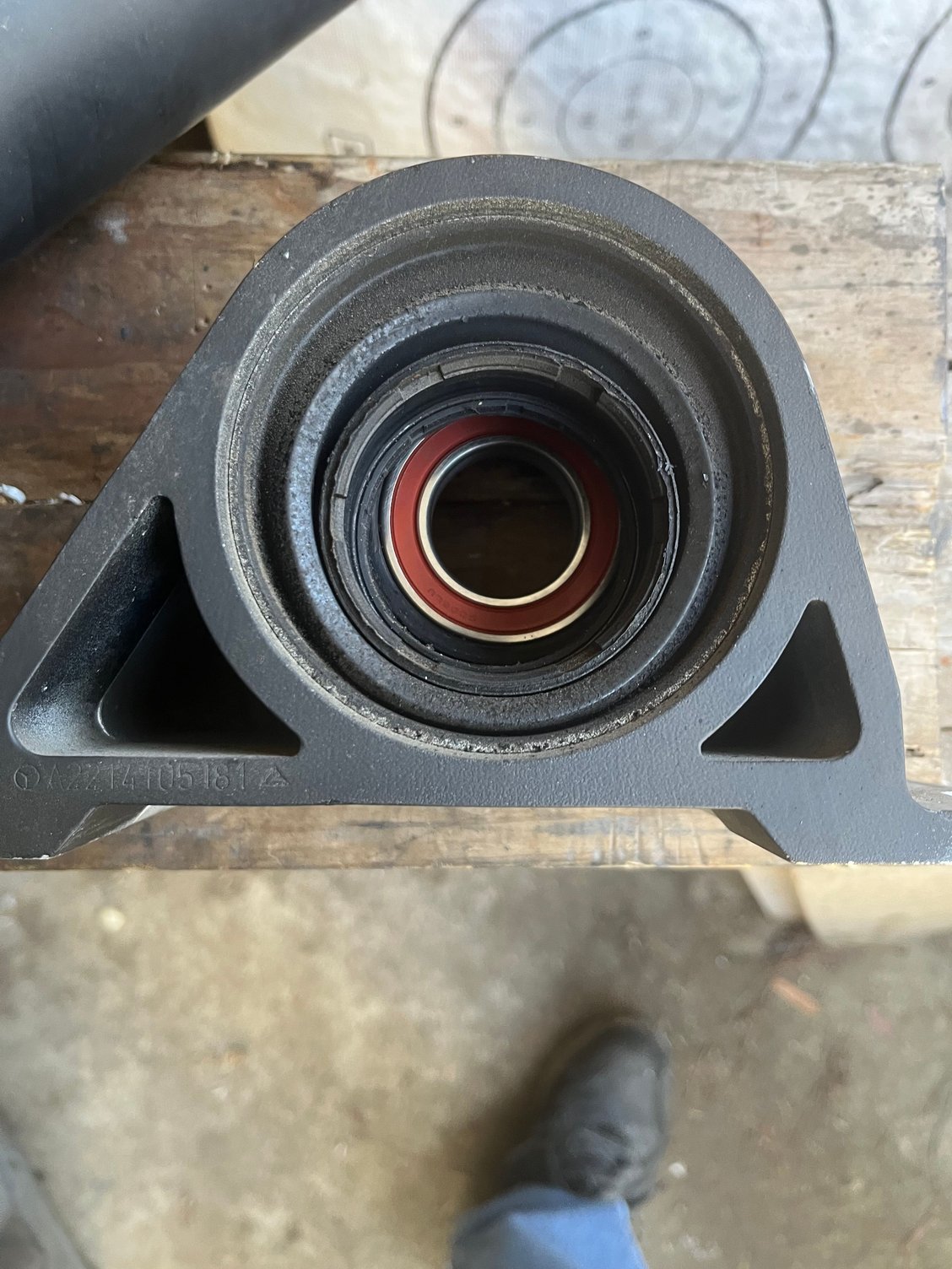 Old bearing housing on top of the new one shows how the old rubber had sagged. 