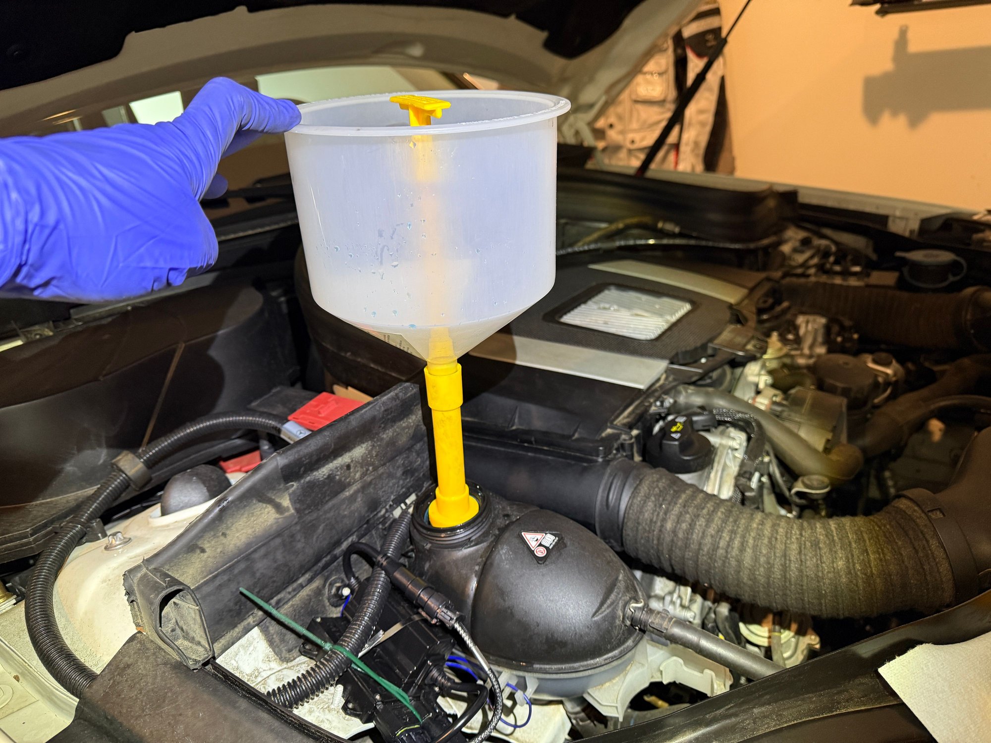 2012 GLK350 coolant fill using big funnel. 