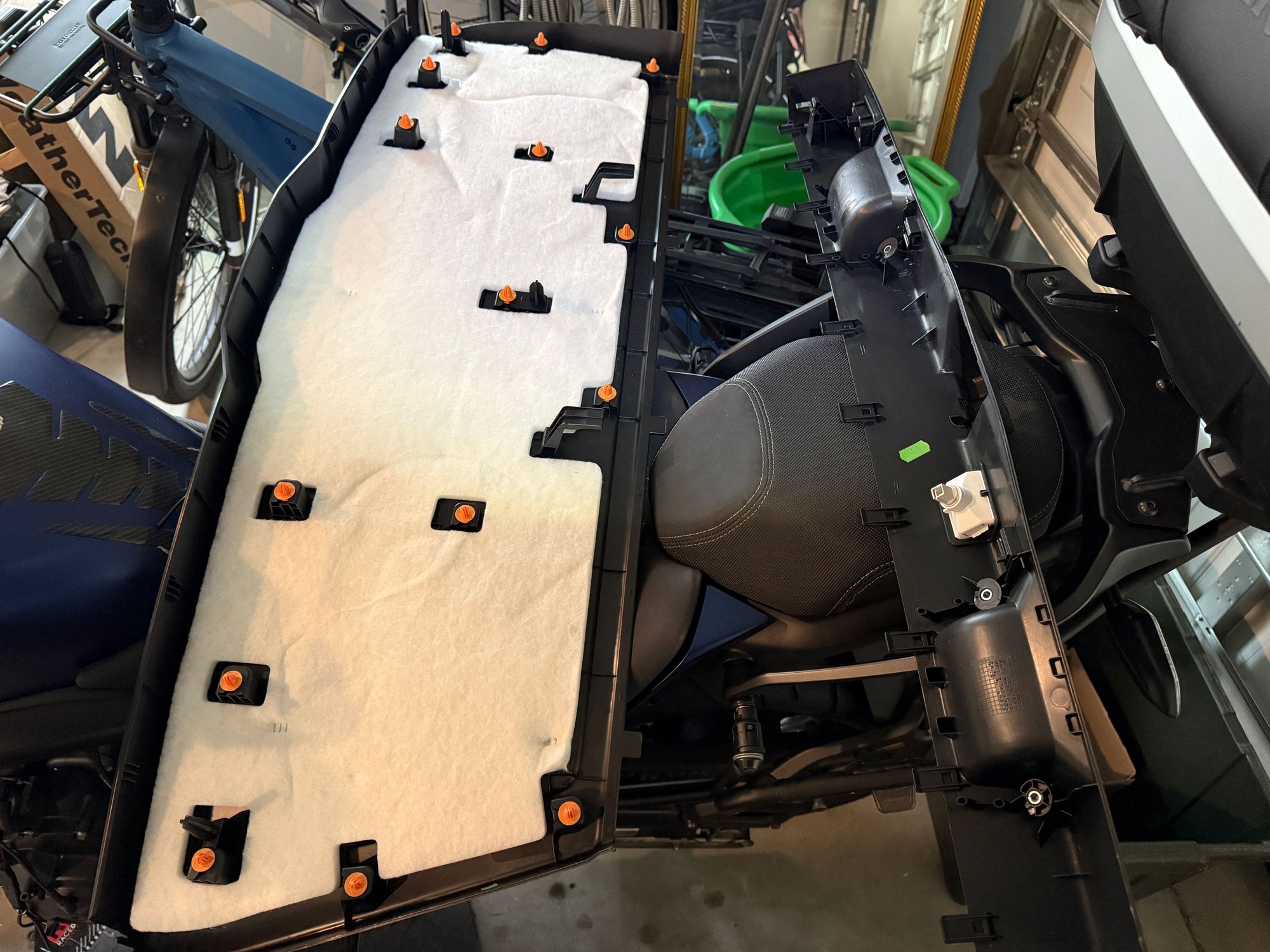 17 interior fasteners (orange) that have to be loosened in order to view the rear trunk lid/boot interior. 