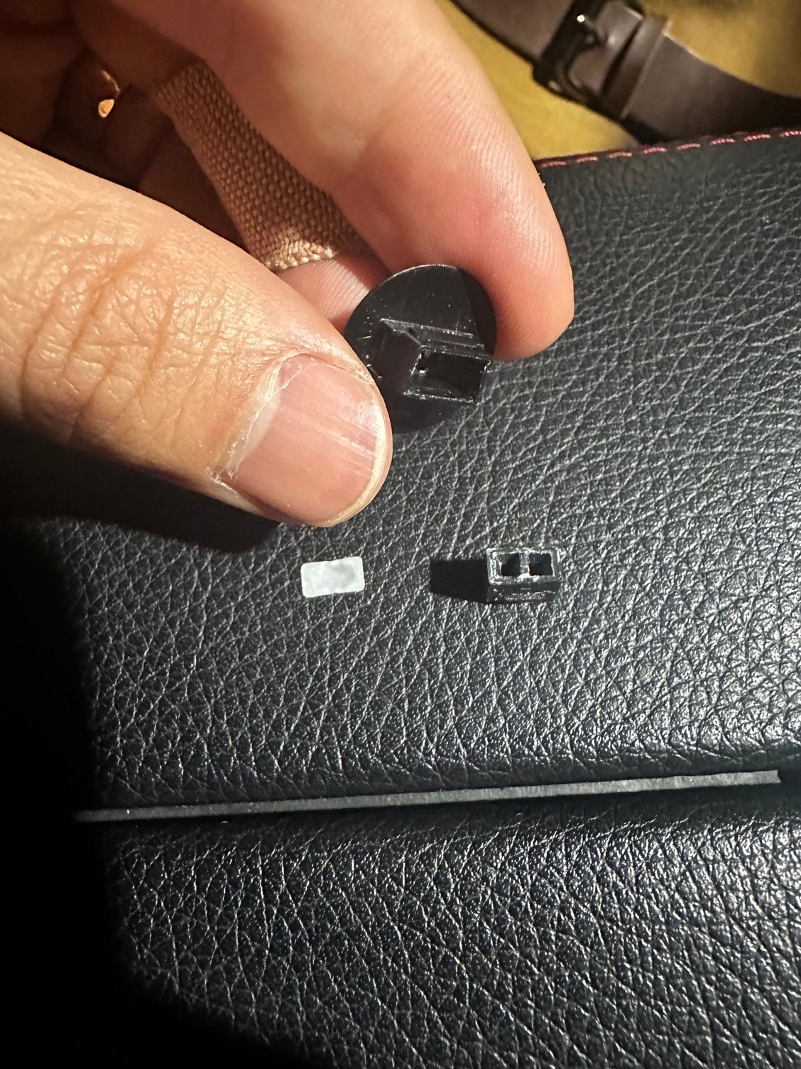 Plastic cover with the rubber insert removed. White plastic for removing