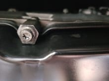 Once you remove the connector you can then drop the pan by removing the 6 T 30 torx bolts surrounding the pan. Remember where they go as the passenger front bolt will need to hold the heat shield again.