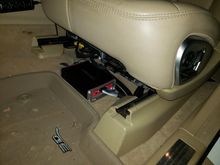 Amplifier under the driver seat.  Subwoofer control mounted on the side of the center console.