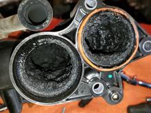 Soot accumulation intake after throttle valve