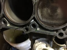 The cause of my coolant leak. The seal from the timing cover to the block. You can see it bottom right of the second cylinder