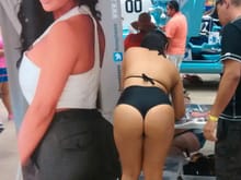 Same car show girl, from behind.