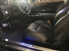 Illuminated door sills with new red, diamond-stiched floor mats and black carpets