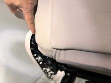 Once that piece is out, it exposes a small screw. I am pointing at it. If you want to remove the plastic outer trim, you’ll have to remove this screw. In order to remove this screw, you’ll have to detach the air bag from the seat frame since it is obscured by the seat back. It’s possible to remove it with an angled t25 tool, but I don’t have that. Removing the air bag is easy at this stage. 