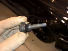 I added electrical tape until the bolt fit nice and tight.  It was probably 15 or so layers of tape.  I trimmed it with a razor so it was only applied to the relevant portion of the bolt.