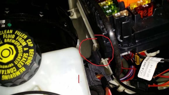 Disconnect and remove the top square rubber stopper. That's the wiper motor harness. There is another rubber stopper on the bottom. Remove that also.
