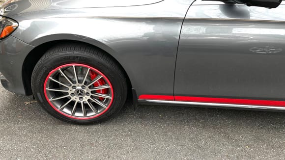 Front rim with red painted calipers and white Mercedes Benz decals 