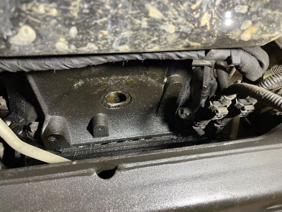 This is a picture looking forward at the bell housing. There is a small (1.25”) hole but no rubber cover like the picture shows in WIS. 

Is that image for a 2012 or 2013?  I have ordered a drive with WIS but won’t get it for a week. 