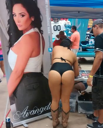 Same car show girl, from behind.