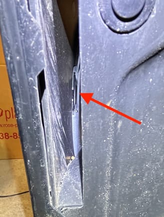 Access lowest outer tab from slot in wheel well.