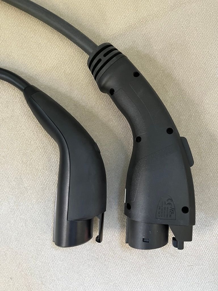 Tesla J1772 on left.
