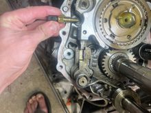My 3D thinking says this is about the right place for the Ballenger sensor. It’s definitely in the fluid, yet should clear both the shift fork and whatever that other rod is. In theory. I will check this tomorrow after reassembly.
