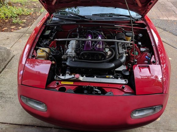 I cut the valve cover and painted it... and I was running an early FM strut bar because I'm kind of a ricer. And yes that's an HKS oil cap and Koyorad for the same reason.