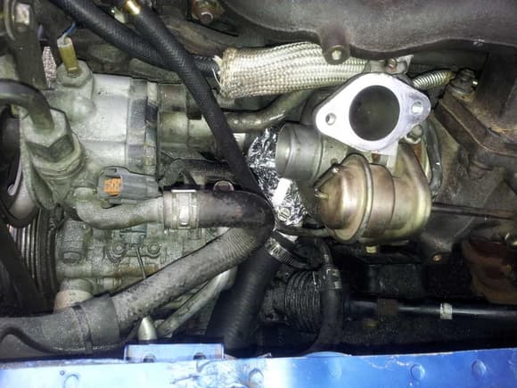 Waterpump inlet redirected in order to not interfere with compressor inlet