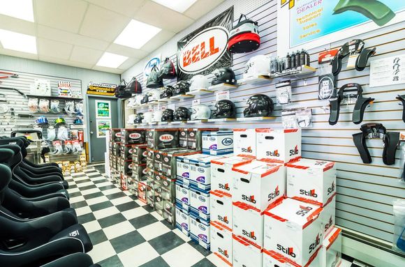 Stable Energies retail store. Helmet and Head/Neck restraint section. Here we do personalized helmet fittings for customers looking to purchase their first or upgrade helmet. We have  various sizes from HJC, Bell, Arai, and Stilo. Stable also offers radio communications helmet installs.