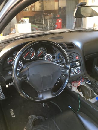 Center shifter console removed to drop transmission