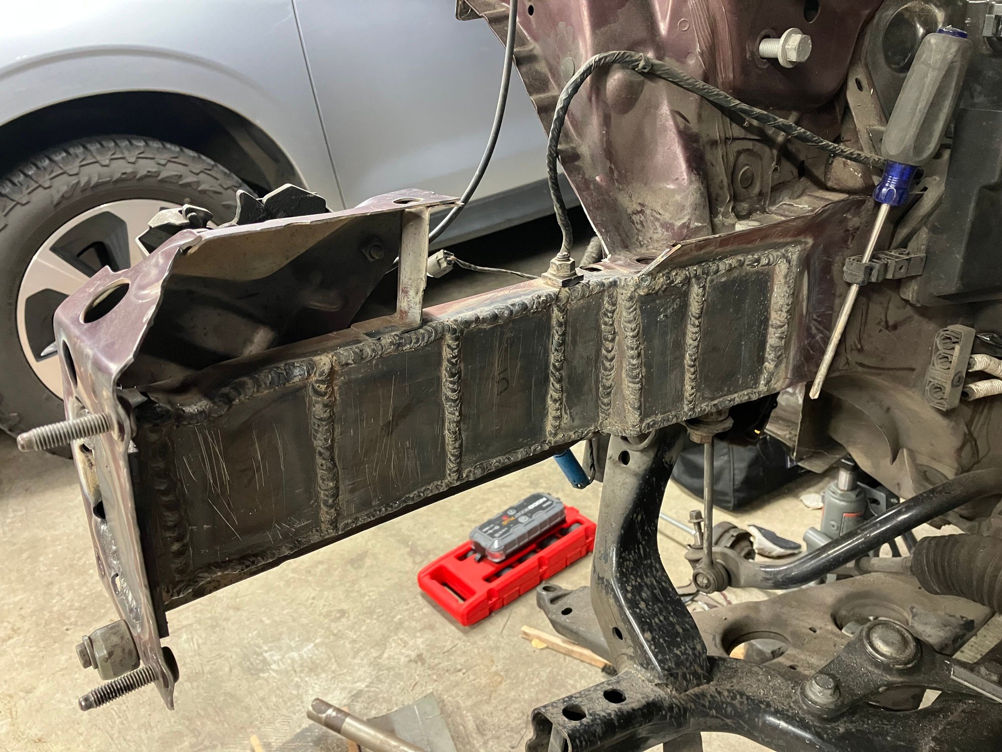 And welded them in place. Not pretty by any standards but it�s not going to fall apart. That�s really all that matters. I thinks once it comes time to paint it all I might sand down the welds a bit so it looks nicer underneath the velvet red paint but for now it will do.