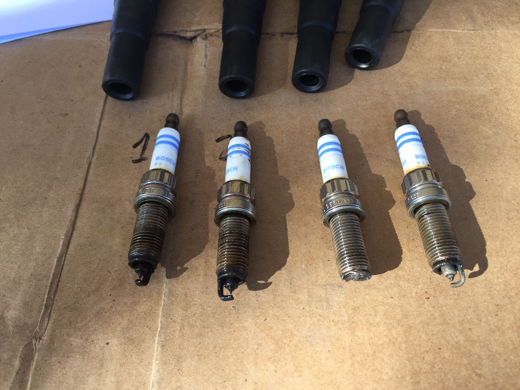 Melted spark plug end North American Motoring