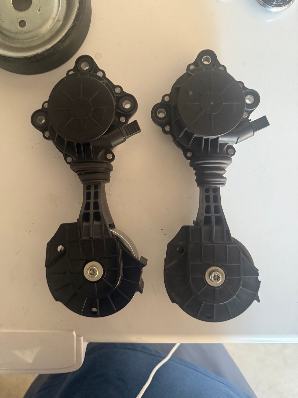 Here�s a side-by-side picture of the new one on the left versus the old one on the right with the pulley cord both retracted all the way in.  You can see the new one on the left is overall shorter because it�s retracted more, and the old one on the right side is like maybe 5 mm longer.  And you can see the rubber boot is a little more stretched out on the old one. 