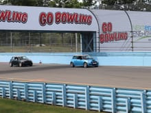 Heading into the front straight at Watkins Glen after the last corner with my MINI buddy Glenn following close behind.