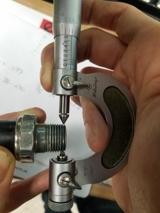 OEM part with the micrometer set to the pitch diameter of the 3/8"-19 BSPT at .622". A gap can clearly be shown on the thimble side insert.