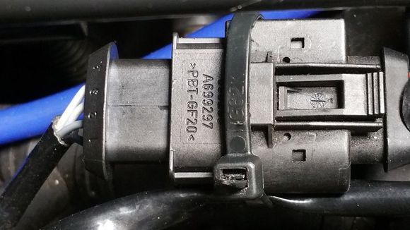 As much I dislike seeing zip-ties retaining parts in the engine compartment; It's better than seeing loose connectors laying around unrestrained.