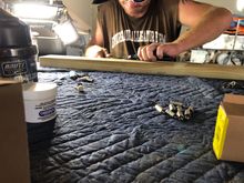 Working on the metal inserts for the screws that hold the  seat cooler hinges.