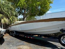 The boat sitting in our customers yard with the old deck still on it.