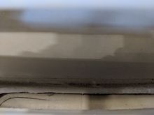 Opening beneath sun pad showing channel to engine compartment.