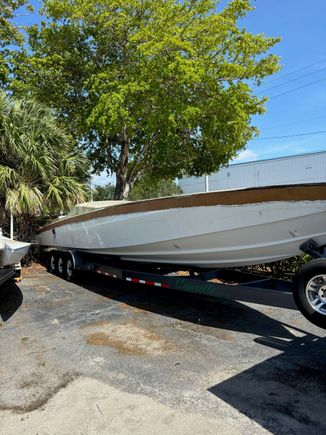 The boat sitting in our customers yard with the old deck still on it.