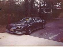 My 1985 Camaro IROC Z, 5.7 litre v8, auto T-tops factory Iroc aluminum alloy wheels.  added a Hyper Tech Stage 5 computer chip and Alpine system with Stillwater kicker made just for the rear well. I loved this car but couldn't afford the insurance at 18 it was jacked up.