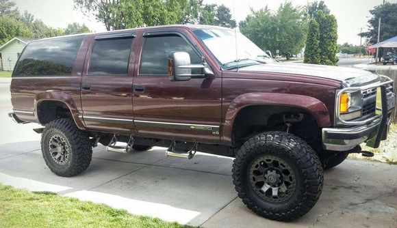 94 Chevy Suburban K2500 5.7L TBI, 3" cat back exhaust w/ FM super 40. FIPK Intake. Dual battery w/ aux fused relay panel. Np241 transfer case. 4L80E trans w/shift kit, Derale trans cooling pan. Mag-Hytec High Cap Diff Cover. 4.88 gears. Eaton e-lockers. 4" susp, 3" body lift. Rancho RS9000 adj. shocks. Pro Comp add-a-leaf, Hellwig helper spring kit. Sway bar quick disconnects.
37X12.50XR17 Toyo Open Country MT's. Black Rhino Warlord wheels.
