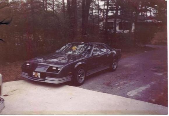 My 1985 Camaro IROC Z, 5.7 litre v8, auto T-tops factory Iroc aluminum alloy wheels.  added a Hyper Tech Stage 5 computer chip and Alpine system with Stillwater kicker made just for the rear well. I loved this car but couldn't afford the insurance at 18 it was jacked up.