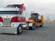 My BJ and the Bear tractor with my lowboy haulin my DUEL tractor