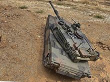 Tamyia Abrams on test course off camber obstacle.