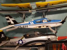 The T-28 below the Camanche is for sales. Also new and never been flown. 