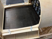 Plate slides back into recepticals in back.  Plate is easy to remove/install