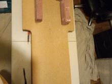 once I cut the tabs and prepared to turn over the boat I made sure to cut the jig to fit the Sponsons and then I screwed the boat square to it. filling 4 small holes was not an issue when keeping the boat square