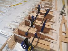 Each rib is held in place by placing these simple rectangle pine blocks that I made on each side of the rib with a clamp.  I made sure when cutting these block that each block is perfectly square.