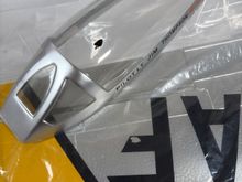 Black spot on canopy is part of the “F” decal on the wing. I should easily come off with minimal effort. One can touch up the F with a black magic marker.