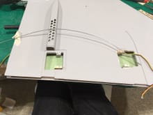 Use a curved wire to route to the outside servo and grab the wire