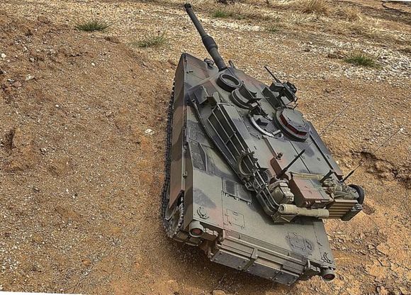 Tamyia Abrams on test course off camber obstacle.