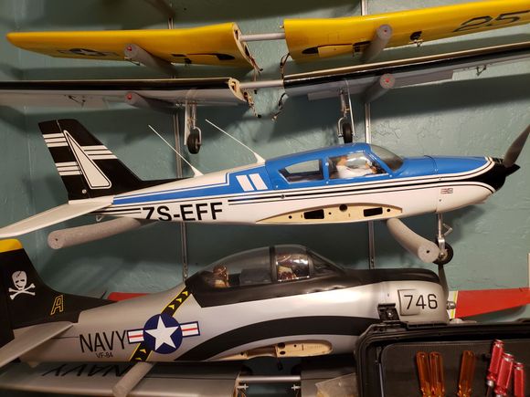 The T-28 below the Camanche is for sales. Also new and never been flown. 