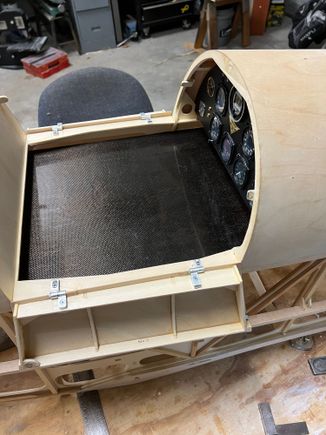 Plate slides back into recepticals in back.  Plate is easy to remove/install