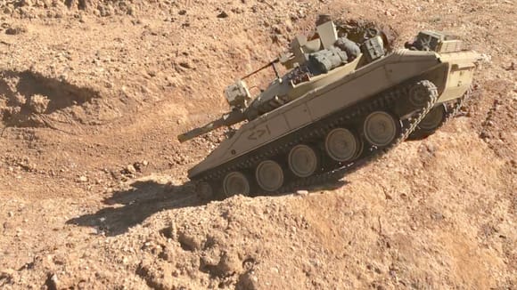 Tamiya M551 Sheridan climbing dirt berm and head down into "L trench" obstacle. 
