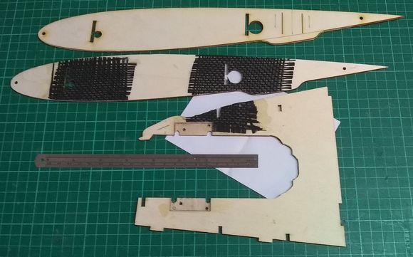 The root ribs are reinforced with carbon cloth on the inside around where the wing supports and undercarriage supports fit.