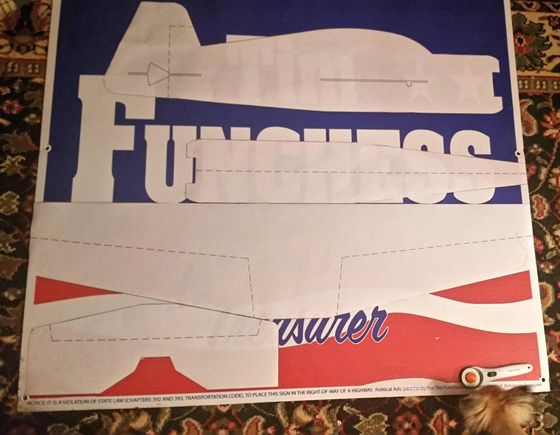 I decided to cut out the parts from the plans so I could position the wing, fuse and elevator on parts of the sign that may look better.